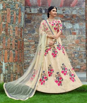 This set options a cream flared kalidaar lehenga skirt in art silk base with pink floral embroidery all over the lehenga. It's paired with cream art silk cold shoulder blouse with pink thread floral work on the front and back. It comes on cream soft net decorated fur border dupatta.