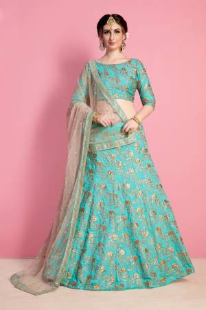 Earn Lots Of Compliments Wearing This Designer Trendy Lehenga Choli In Turquoise Blue Color Paireed With Beige Colored Dupatta. Its Blouse And Lehenga Are Fabricated On Art Silk Paired With Net Fabricated Dupatta. Its Lovely Color And Embroidery Will Give An Attractive Look Like Never Before.