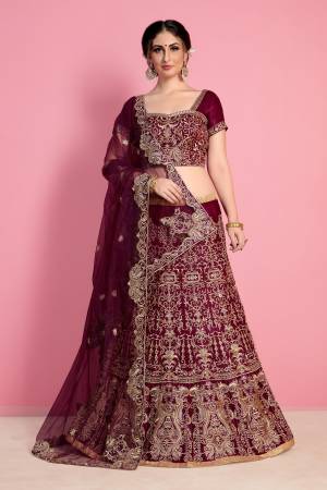 New And Unique Shade Is Here With This Designer Lehenga Choli In Wine Color Paired With Wine Colored Dupatta. This Legenga Choli Is Fabricated On Velvet Silk Paired With Net Fabricated Dupatta. Buy This Lehenga Choli Now.