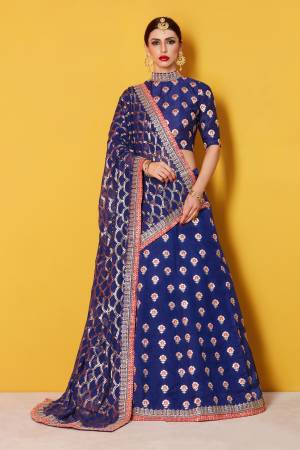 This set features a navy blue semi art silk zari work lehenga choli set. It comes along with zari and dori lace work on dupatta and heavy embroidery sequins work on dupatta. Matching blouse with heavy zari work butti.