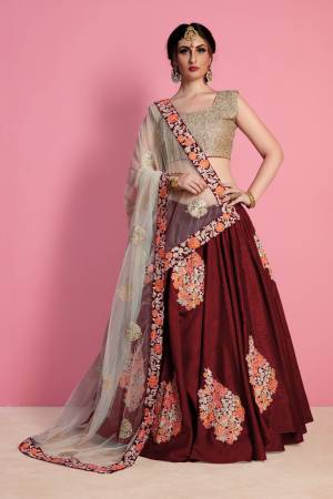 Maroon color leheng with multi color thread work is base on Art silk fabric with Cream color dupatta is base on net with have thread work lace on dupatta with embroidery worked blouse.