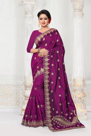 Add This New Shade To Your Wardrobe With This Designer Saree In Wine Color Paired With Wine Colored Blouse. This Saree And Blouse Are Fabricated On Art Silk Beautified With Jari Embroidery And Stone Work.