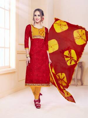 Adorn The Pretty Angelic Look Wearing This Suit In Red Colored Top And Dupatta Paired With Contrasting Yellow Colored Bottom. This Dress Material Is Fabricated On Cotton Paired With Chiffon Dupatta. Buy Now.