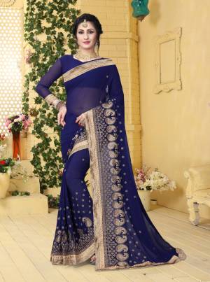 Grab This Beautiful And Attractive Dark Blue Colored Saree Paired With Dark Blue Colored Blouse. This Saree And Blouse Are Fabricated On Georgette Beautified With Jari Embroidery. Buy Now.