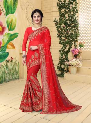 Adorn The Pretty Angelic Look Wearing This Designer Saree In Red Color Paired With Red Colored Blouse. This Saree And Blouse are Georgette Based Beautified With Jari Embroidery. Buy This Pretty Saree Now.