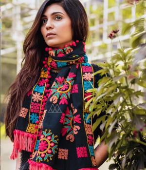 Adopt The Seasons Fashion With This Khadi Fabricated Beautiful Scarf Beautified with Multi Colored Woollen Thread Embroidery. It Can Be Paired With Simple Kurti Or Even Western Tops.