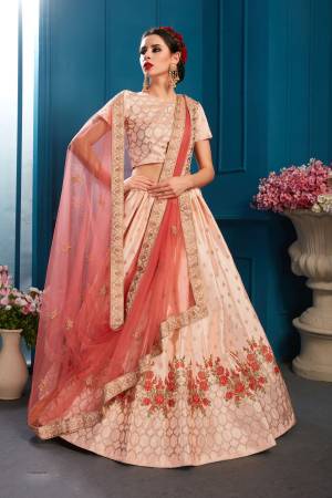 Look Pretty In This Lovely Shade With This Designer Heavy Lehenga Choli In Light peach Color Paired With Dark Peach Colored Dupatta. Its Blouse And Lehenga Are Satin Based Paired With Net Fabricated Dupatta. 