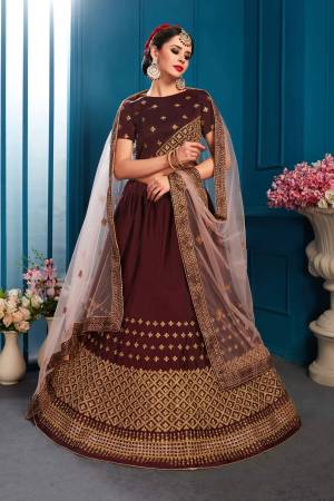 For A Bold And Beautiful Look, Grab This Designer Lehenga Choli In Brown Color Paired With Contrasting Baby Pink Colored Dupatta. This Lehenga Choli Is Satin Based Paired With Net Fabricated Dupatta. Buy This Lehenga Choli Now.