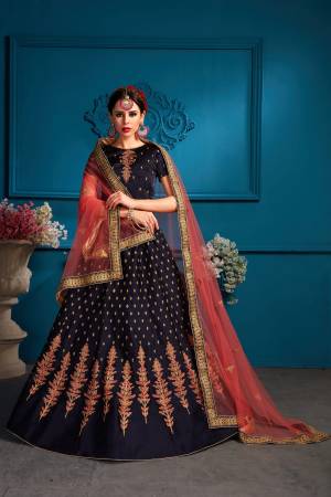 Enhance Your Personality Wearing This Designer Lehenga Choli In Navy Blue Color Paired With Contrasting Dark Peach Colored Dupatta.  Its Blouse And Lehenga Are Fabricated On Satin Paired With Net Fabricated Dupatta. All Its Fabrics Ensures Superb Comfort All Day Long. Buy Now.