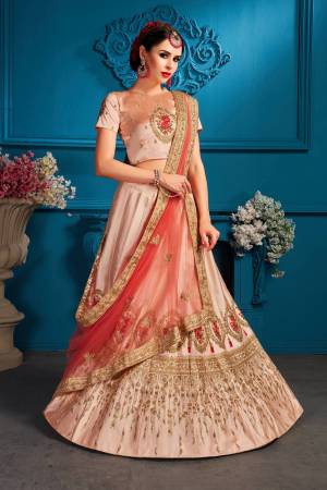 Look Pretty In This Lovely Shade With This Designer Heavy Lehenga Choli In Light peach Color Paired With Dark Peach Colored Dupatta. Its Blouse And Lehenga Are Satin Based Paired With Net Fabricated Dupatta. 