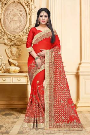 Adorn The Pretty Angelic Look Wearing This Designer Saree In Red Color Paired With Red Colored Blouse. This Saree And Blouse Are Georgette Based Beautified With Heavy Jari Embroidery And Stone Work. Buy Now.