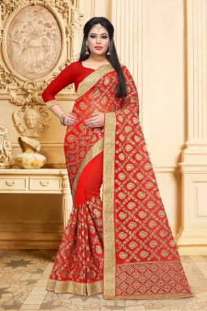 Adorn The Pretty Angelic Look Wearing This Designer Saree In Red Color Paired With Red Colored Blouse. This Saree And Blouse Are Georgette Based Beautified With Heavy Jari Embroidery And Stone Work. Buy Now.