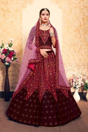 For A Royal Look, Grab This Rich Color Pallet Heavy Designer Lehenga Choli In Maroon Color Paired With Contrasting Pink Colored Dupatta. This Lehenga Choli Is Satin Based Paired With Net Fabricated Dupatta. Both The Fabrics Ensures Superb Comfort Throughout The Gala.