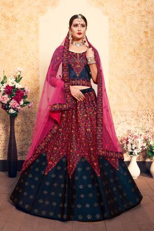 For A Royal Look, Grab This Rich Color Pallet Heavy Designer Lehenga Choli In Dark Blue Color Paired With Contrasting Dark Pink Colored Dupatta. This Lehenga Choli Is Satin Based Paired With Net Fabricated Dupatta. Both The Fabrics Ensures Superb Comfort Throughout The Gala.