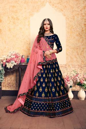 Dark Colors Gives A More Pretty Look To Your Personality, So Grab This Heavy designer Lehenga Choli In Royal Blue Color Paired With Contrasting Pink Colored Dupatta, This Lehenga Choli Is Fabricated On Satin Paired With Net Fabricated Dupatta. It Has Very Pretty Contrasting Embroidery All Over It.