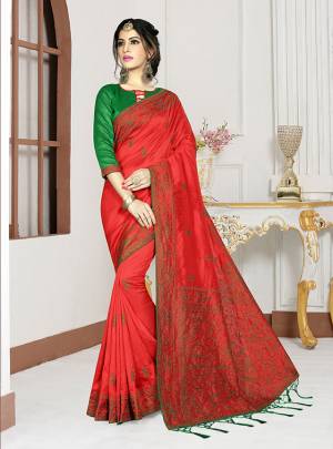 Add This Pretty Bright Shade To Your Wardrobe With This Designer Saree In Crimson Red Color Paired With Contrasting Green Colored Blouse. This Saree And Blouse Are Fabricated On Art Silk Which Also Gives A Rich Look To Your Personality. 