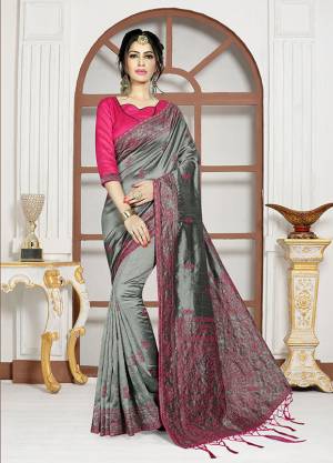 For A Bold And Beautiful Look, Grab This Designer Saree In Steel Grey Color Paired With Rani Pink Colored Blouse. This Satee And Blouse Are Silk based Beautified With Resham Embroidery And Stone Work. 