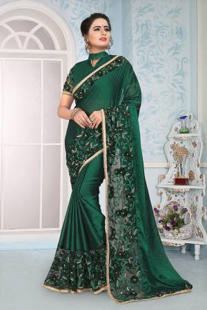 Grab This Designer Saree In Dark Green Color Paired With Dark Green Colored Blouse. This Saree Is Fabricated On Satin Silk Paired With Art Silk Fabricated Blouse. 