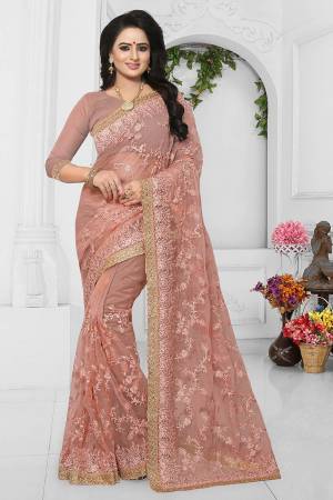 Look Beautiful In This Heavy Designer Net Based Saree. This Saree And Blouse Are Fabricated On Net Beautified With Heavy Embroidery. It Is Easy To Drape And Comfortable To Carry All Day Long. 