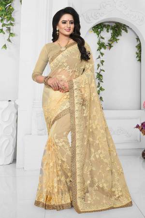 Grab This Heavy Designer Saree For The Upcoming Wedding Season. This Beautiful Heavy Embroidered Saree And Blouse Are Fabricated On Net Beautified With Resham Embroidery And Stone Work. Pair It Up Minimal Elegant Accessories. 