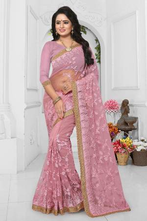 Look Beautiful In This Heavy Designer Net Based Saree. This Saree And Blouse Are Fabricated On Net Beautified With Heavy Embroidery. It Is Easy To Drape And Comfortable To Carry All Day Long. 