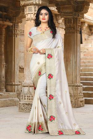 Get Ready For The Upcoming Festive And Wedding Season Wearing This Designer Silk based Saree Beautified With Jari And Thread Work. This Saree Gives A Rich Look To Your Personality. 