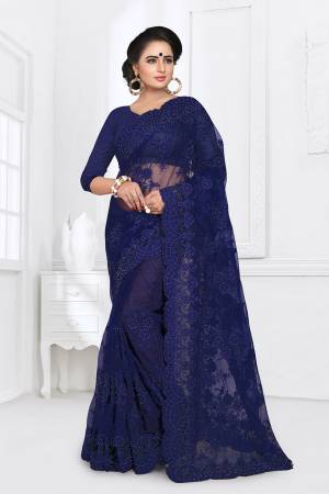 You Will Definitely Earn Lots Of Compliments Wearing This Heavy Designer Saree. This Saree And Blouse Are Fabricated On Net Beautified With Heavy Resham Embroidery With Ceramic Stone Work All Over It. 