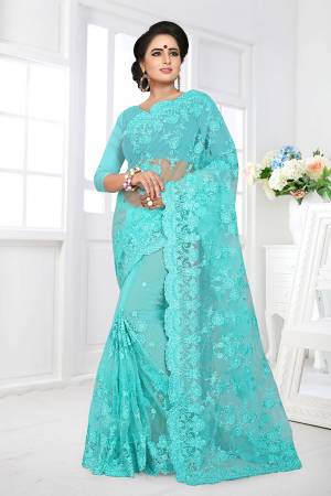 You Will Definitely Earn Lots Of Compliments Wearing This Heavy Designer Saree. This Saree And Blouse Are Fabricated On Net Beautified With Heavy Resham Embroidery With Ceramic Stone Work All Over It. 