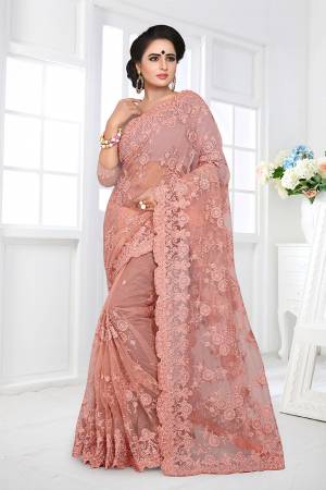 If You Are Fond Of Tone On Tone Embroidery, than This Designer Saree In Perfect For Your. This Heavy Saree And Blouse Are Fabricated On Net Beautified With Tone To Tone Heavy Resham Embroidery With Ceramic Stone Work All Over It. Buy This Saree Now.