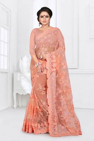 You Will Definitely Earn Lots Of Compliments Wearing This Heavy Designer Saree. This Saree And Blouse Are Fabricated On Net Beautified With Heavy Resham Embroidery With Ceramic Stone Work All Over It. 