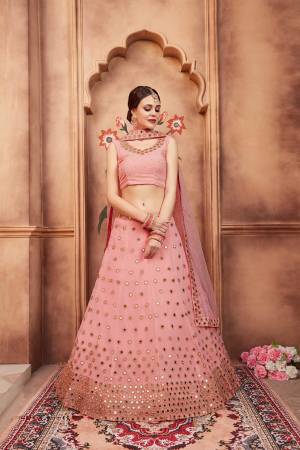 Look Pretty In this Designer Baby Pink Colored Lehenga Choli. Its Pretty Blouse And Lehenga Are Fabricated On Georgette Paired With Net Fabricated Dupatta. It Is Beautified With Mirror And Stone Work. 