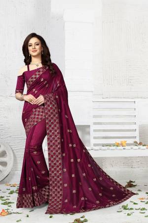 Here Is A Beautiful Wine Colored Saree Paired With Wine Colored Blouse. This Saree And Blouse Are Silk Based Beautified With Attractive Jari Embroidery. Buy This Designer Saree Now.