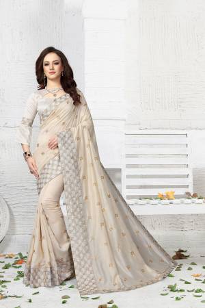 Simple And Elegant Looking Designer Saree Is Here In Off-White Color Paired With Off-White Colored Blouse. This Saree And Blouse Are Silk Based Beautified With Jari Embroidery. 