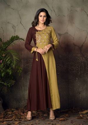 Simple and Elegant Looking Designer Readymade Gown Is Here In Brown And Pear Green Color Fabricated On Rayon. It Is Beautified With Attractive Thread Work Over The Yoke. Buy Now.