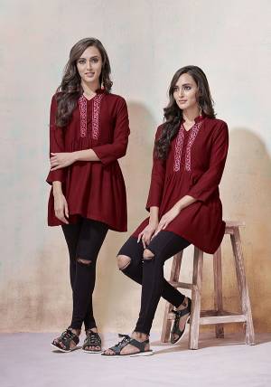 Simple And Elegant Looking Designer Readymade Top Is Here In Maroon Color Fabricated On Rayon. It Is Beautified With Multi Colored Thread Work And Available In All Regular Sizes. 