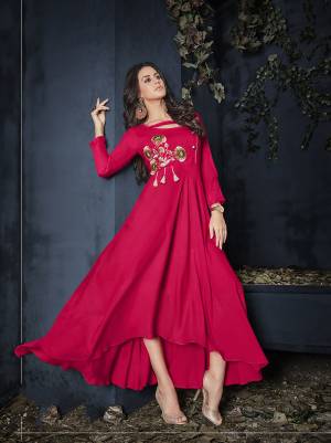 Shine Bright In This Readymade Designer Gown In Dark Pink Color Fabricated On Rayon Beautified With Thread Work. It Has Pretty High Low Pattern And You can Wear It As it Is Or Pair Up With A Leggings. Buy Now.