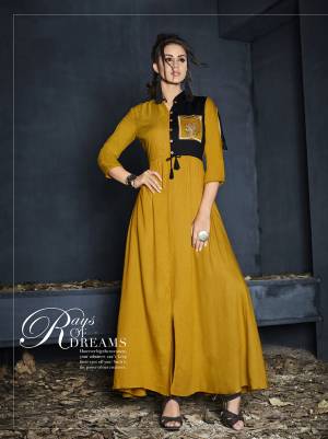 Celebrate This Festive Season Wearing This Designer Readymade Gown In Musturd Yellow Color Fabricated On Rayon. It Is Beautified With Minimal Thread Work. Also It Is Light Weight Which Lets You Enjoy Your Festive Feels Comfortably.