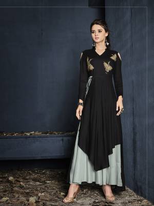 New And Unqiue Double Layered Pattern Is Here With This Designer Readymade Gown In Black And Grey Color Fabricated On Rayon. This Gown IS Beautified With Thread Work Over The Yoke And Its Lovely Pattern Will Earn You Lots Of Compliments From Onlookers. 