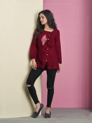 For Your Semi-Casual Wear, Grab This Designer Readymade Top In Maroon Color Fabricated On Rayon. It IS Beautified With Thread Work Butta And Lovely Pattern. Buy Now.