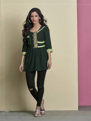 Enhance Your Personality Wearing This Designer Readymade Top In Dark Green Color Fabricated On Rayon. It IS Beautified With Thread Work and Also It IS Light Weight And Easy To Carry All Day Long. 