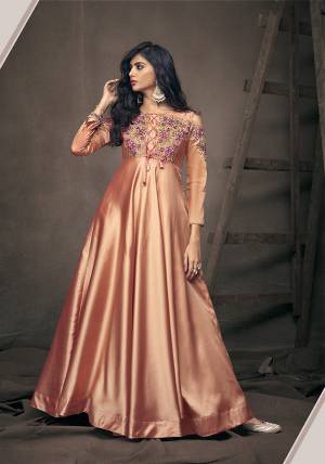 A Must Have Shade In Every Womens Wardrobe Is Here With This Designer Readymade Gown In Peach Color. It Is Beautified With Lovely Patterns And Embroidery Over The Yoke And Sleeves. Buy This Pretty Gown Now.