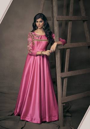 Get Ready For The Upcoming Festive And Wedding Season With This Designer Readymade Gown In Rani Pink Fabricated On Satin Silk. This Pretty Gown Has Attractive Embroidery Over The Yoke And Sleeves. Buy Now.