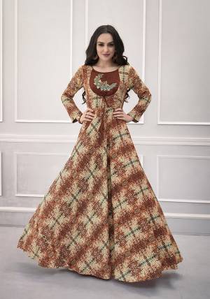 Rich And Elegant Looking Designer Readymade Gown Is Here In Brown Color Fabricated On Rayon. It Is All Beautified With Intricate Prints, And Hand work Over The Yoke. 