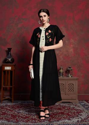 For A Bold And Beautiful Look, Grab This Designer Readymade Kurti With Jacket In Off-White Colored Inner Paired With Black Colored Embroidered Long Jacket. Its Inner Is Rayon Cotton Based Paired With Muslin Jacket. You Can wear It As Ir And Also Pair Up With Pants Or Leggings. 