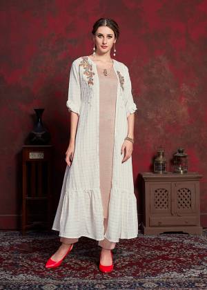 Celebrate This Festive Season With Beauty And Comfort Wearing This Designer Readymade Kurti In Beige Colored Inner Paired With White Colored Jacket. Its Inner Is Fabricated On Rayon cotton Paired With Muslin Fabricated Jacket. Its Rich And Subtle Color Pallete Will Earn You Lots Of Compliments From Onlookers. 