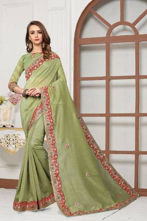 Grab This Very Beautiful Designer Saree In Grey Color For The Upcoming Festive And Wedding Season. This Saree And Blouse Are Fabricated On Cotton Silk Beautified With Heavy Embroidered Lace Border And Butti. Its Rich Fabric And Color Will Earn You Lots Of Compliments From Onlookers. 