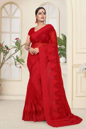 Adorn The Angelic Look In This Heavy Designer Tone To Tone Embroidered Saree In Red Color. This Saree And Blouse Are Fabricated On Net Highlighted With Tone To Tone Ceramic Stone Work All Over It