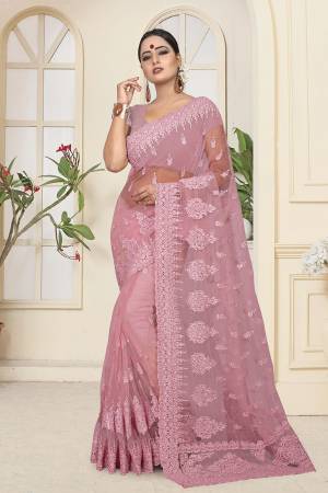 Look Pretty In This Very Beautiful Designer Net Based Saree In Pink Color. This Pretty Saree And Blouse Are Beautified With Tone To Tone Resham And Ceramic Stone Work. Buy Now.