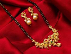 Grab This Heavy Double Chained Magalsutra Set Which Has A Heavy Designer Attatched Pendant With A Pair Of Earrings. This Mangalsutra Can Be Paired With Any Colored Traditional Attire And Suitable For Occasion Wear. Buy Now