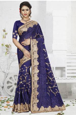 Enhance Your Personality Wearing This Heavy Embroidered Designer Saree In Navy Blue Color. This Saree Is Fabricated On Georgette Paired With Art Silk Fabricated Blouse. Its Fabric Is Durable And Easy To Carry All Day Long.